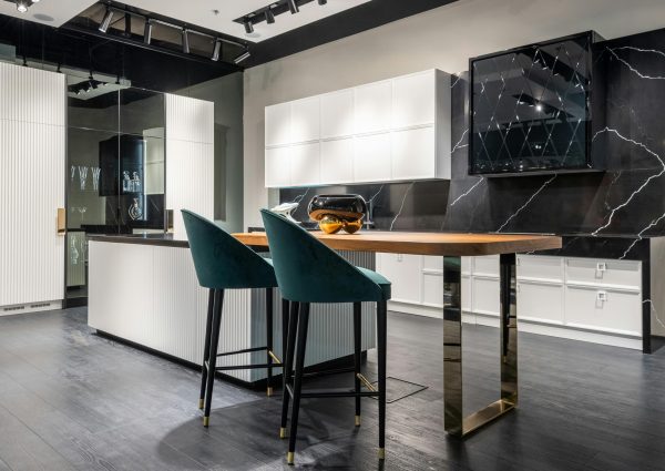 Contemporary kitchen design with sleek black marble and minimalist decor, ideal for modern living spaces.